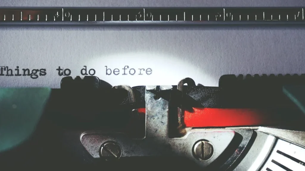 Gothic twin towers of the Church of Our Lady before Týn rising above Prague’s Old Town Square at dusk